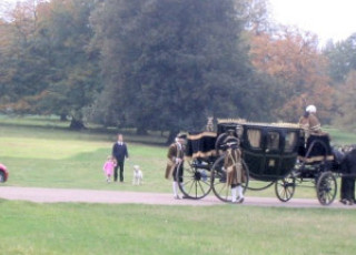 The Curzon family watching the coach